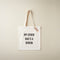 White tote bag with text 'My other bag's a Birkin' on a beige background
