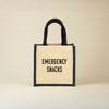 Jute bag with 'Emergency Snacks' text on a beige background