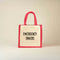 Jute bag with red handle and 'EMERGENCY SNACKS' text on a beige background