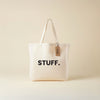 Tote bag with 'STUFF.' text on a beige background