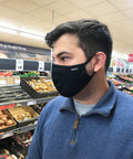 Man wearing black Maskari face mask in a supermarket