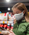 Woman wearing a white Maskari face mask in a supermarket